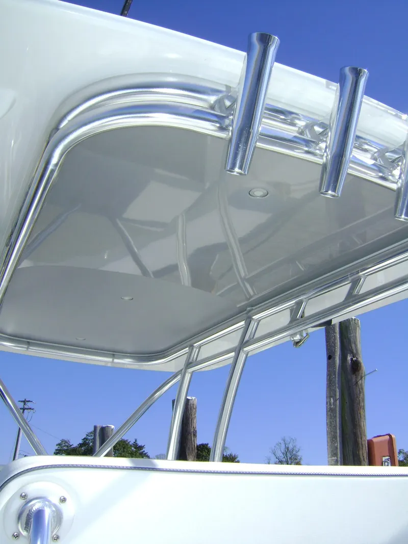 Slide: The Image of 2024 Jersey Cape 31 Little Devil boat with sleek hardtop and rod holders. - 16