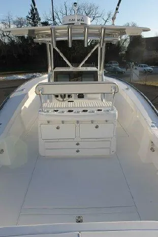 Slide: The Image of 2024 Jersey Cape 31 Little Devil boat interior with center console and storage. - 18
