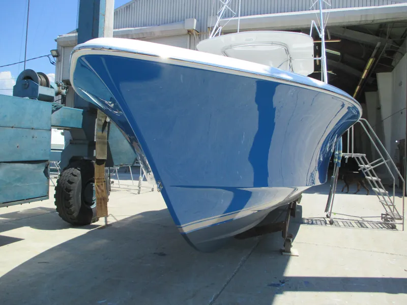 Slide: The Image of 2024 Jersey Cape 31 Little Devil boat in a shipyard. - 2