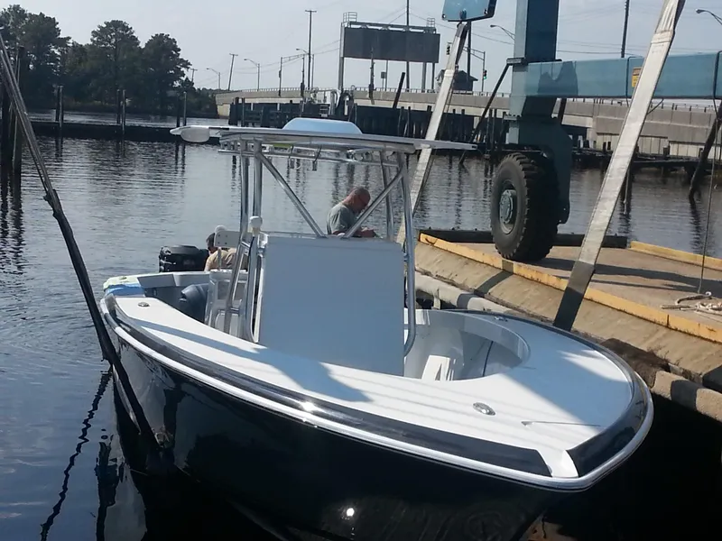 Slide: The Image of 2024 Jersey Cape 31 Little Devil boat docked at a marina. - 21