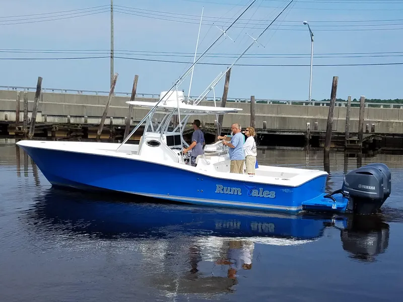 Slide: The Image of 2024 Jersey Cape 31 Little Devil boat on water with people onboard. - 28
