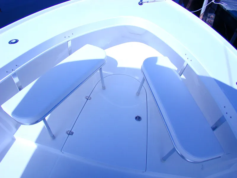 Slide: The Image of 2024 Jersey Cape 31 Little Devil boat seating area with white benches. - 35