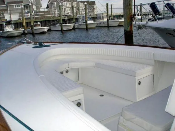 Slide: The Image of 2024 Jersey Cape 31 Little Devil boat docked, featuring spacious seating and modern design. - 45