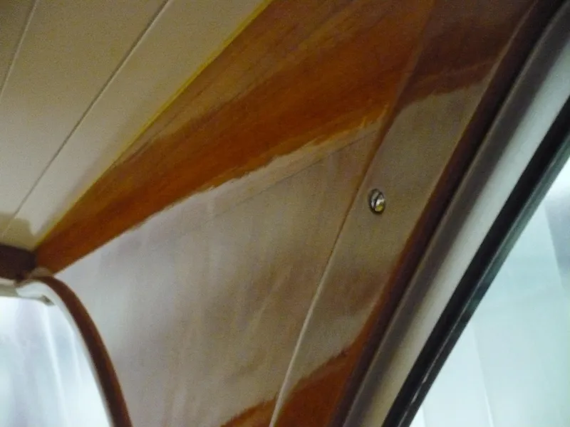 Slide: The Image of Interior wood paneling of a 1999 Classic Coaster Picnic Boat. - 26
