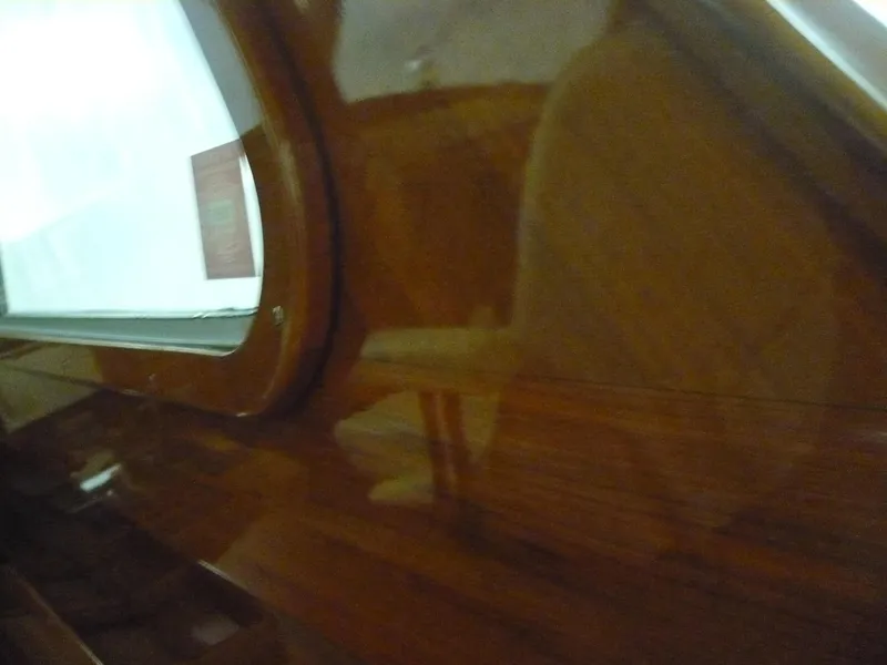 Slide: The Image of Polished wooden interior of a 1999 Classic Coaster Picnic Boat. - 29
