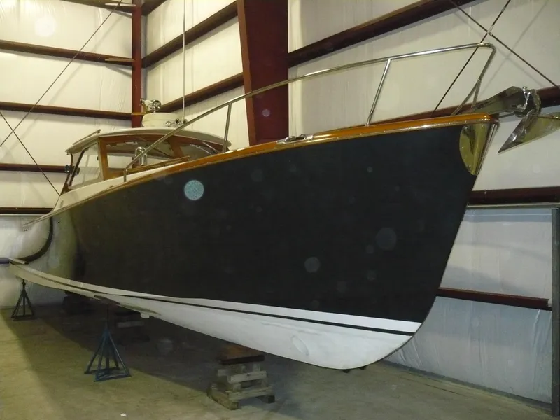 Slide: The Image of Classic Coaster 1999 Picnic Boat in storage, showcasing sleek design and craftsmanship. - 37