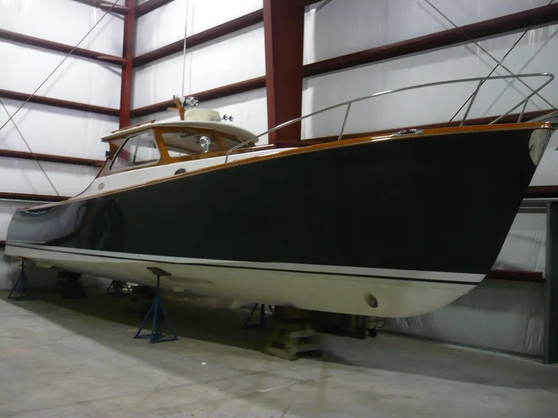 Slide: The Image of 1999 Classic Coaster Picnic Boat in storage, showcasing elegant design and craftsmanship. - 38