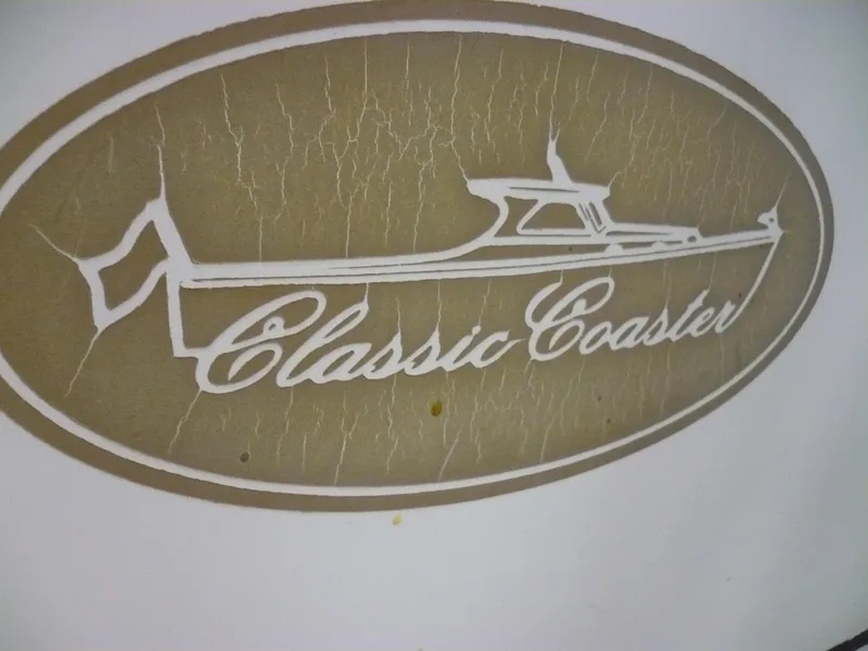 Slide: The Image of Classic Coaster Picnic Boat logo, 1999 model, featuring elegant design on a textured background. - 4