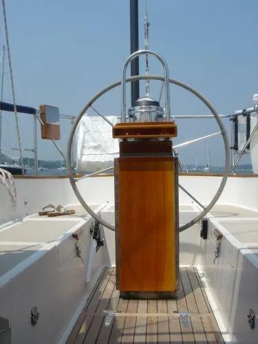Slide: The Image of 1980 Hinckley 43 yacht cockpit with wooden helm and steering wheel. - 12