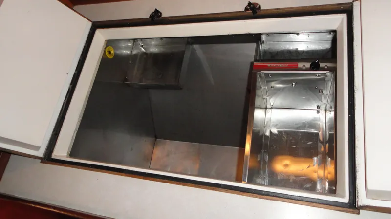 Slide: The Image of Interior view of a 1980 Hinckley 43 yacht storage compartment. - 28