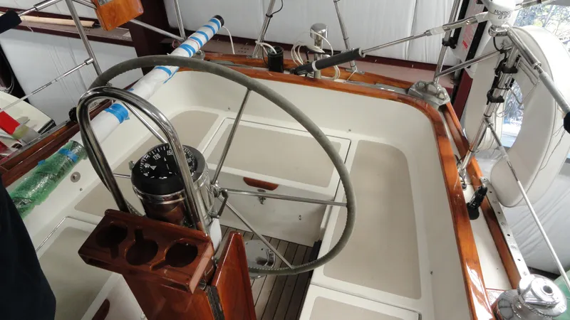 Slide: The Image of Cockpit of a 1980 Hinckley 43 sailboat with steering wheel and compass. - 39