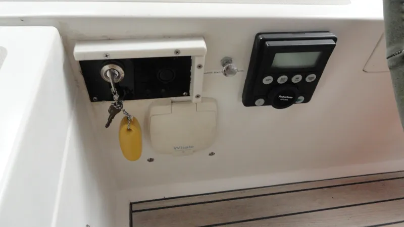 Slide: The Image of Control panel of a 1980 Hinckley 43 boat with ignition key and digital display. - 40