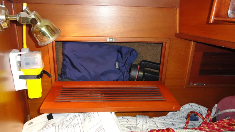 Slide: The Image of Interior of 1980 Hinckley 43 sailboat with storage compartment and nautical equipment. - 24