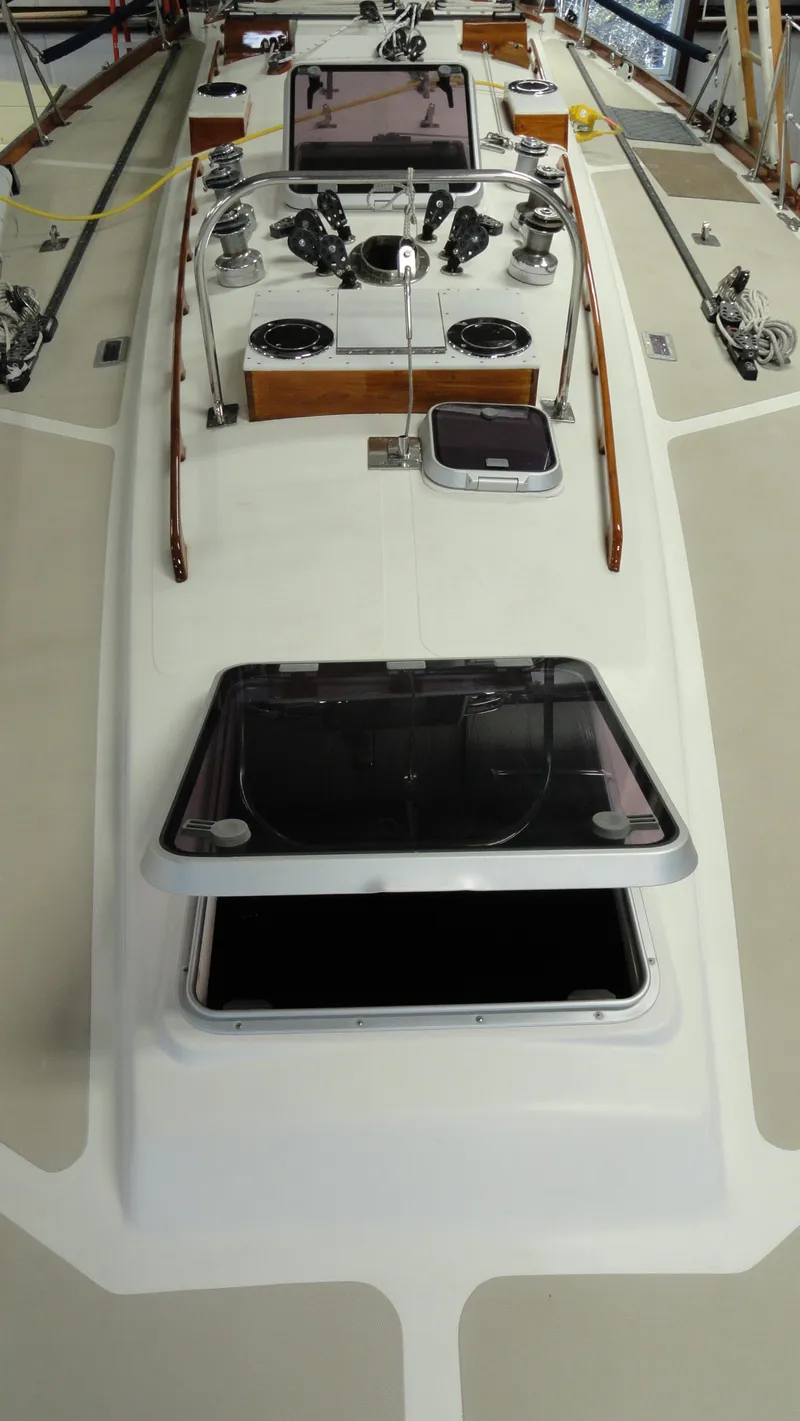 Slide: The Image of 1980 Hinckley 43 sailboat deck with open hatches and winches. - 41