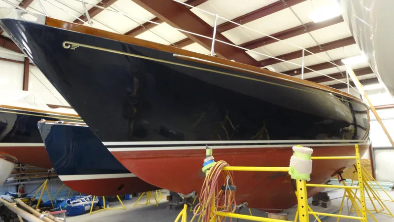 Slide: The Image of 1980 Hinckley 43 sailboat in storage, showcasing sleek design and classic craftsmanship. - 44