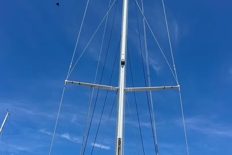 Slide: The Image of Mast of 1980 Hinckley 43 sailboat against clear blue sky. - 46