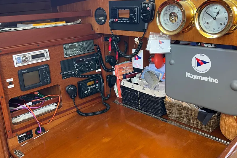 Slide: The Image of Navigation equipment and controls inside a 1980 Hinckley 43 sailboat cabin. - 54
