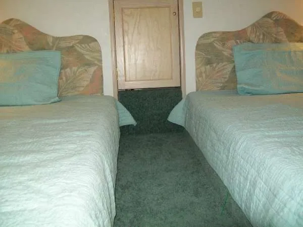Slide: The Image of Interior of a 1999 Gibson 44 Standard Houseboat with twin beds. - 15