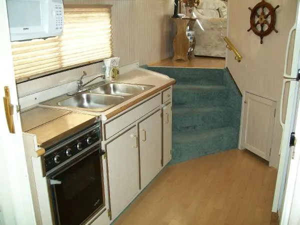 Slide: The Image of Interior of 1999 Gibson 44 Standard houseboat kitchen. - 16