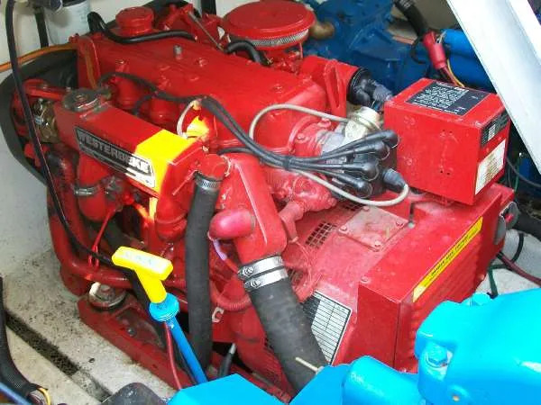 Slide: The Image of Red engine of a 1999 Gibson 44 Standard Houseboat. - 19