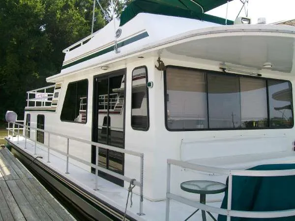 Slide: The Image of 1999 Gibson 44 Standard Houseboat docked. - 3