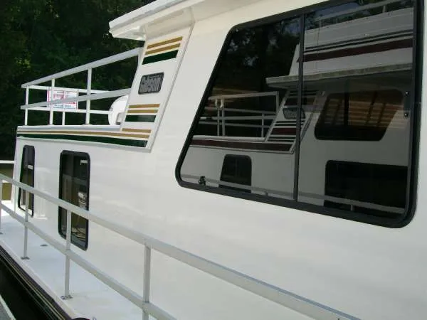 Slide: The Image of 1999 Gibson 44 Standard Houseboat, side view with windows. - 4