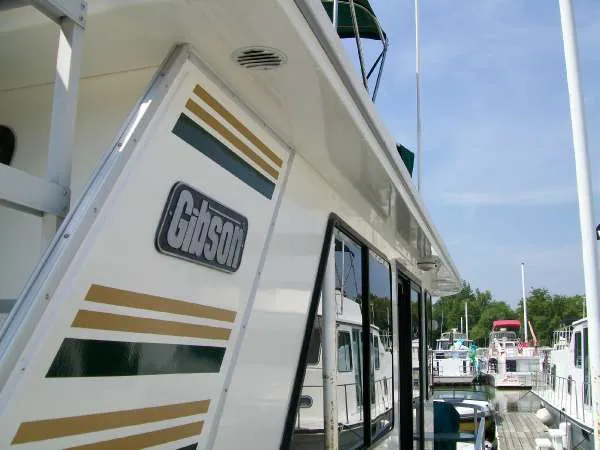 Slide: The Image of 1999 Gibson 44 Standard Houseboat docked at marina. - 5