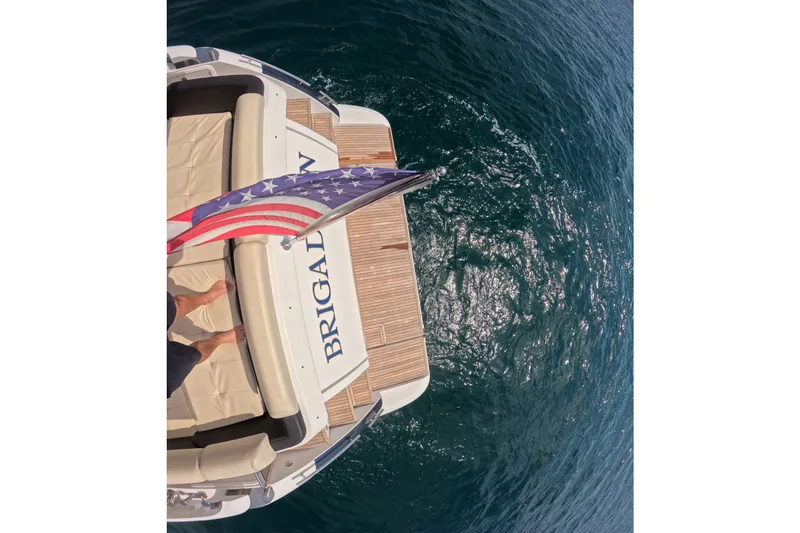 Slide: The Image of Azimut 55S yacht rear view with American flag over ocean, 2016 model. - 33