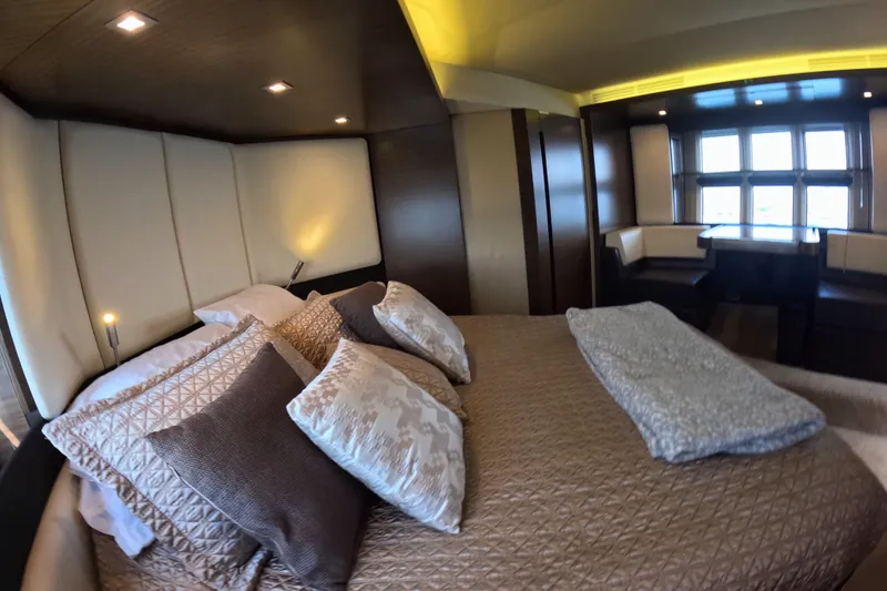 Slide: The Image of Luxurious bedroom interior of 2016 Azimut 55S yacht with elegant bedding and seating area. - 85