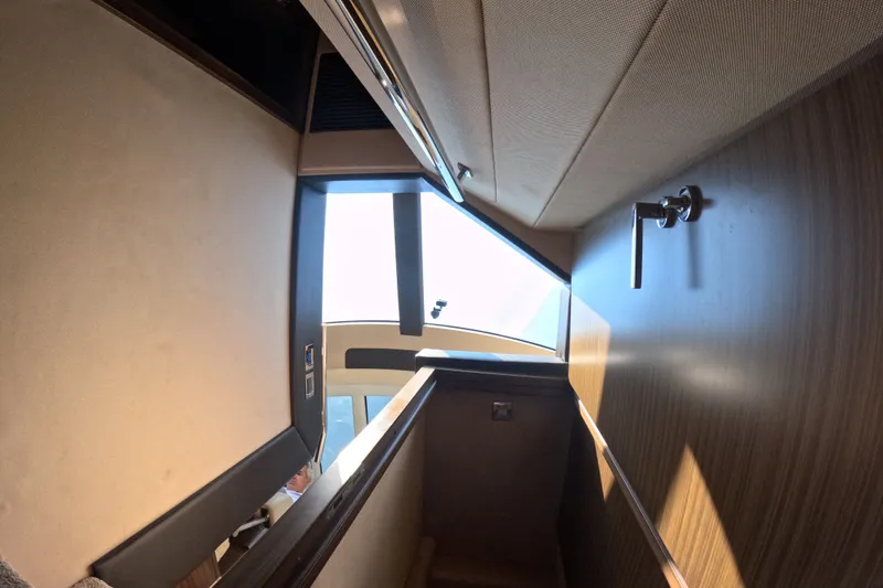 Slide: The Image of Interior view of 2016 Azimut 55S yacht, showcasing modern design and wood finishes. - 76