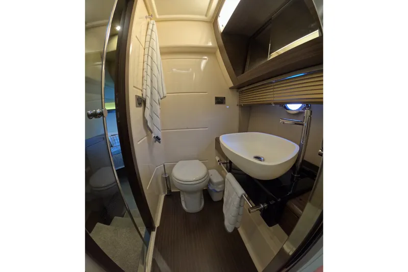 Slide: The Image of Luxurious bathroom in a 2016 Azimut 55S yacht, featuring modern fixtures and elegant design. - 95