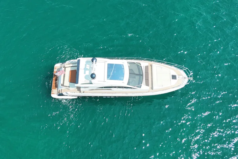 Slide: The Image of Aerial view of 2016 Azimut 55S yacht on turquoise water. - 9