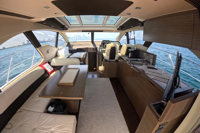 Slide: The Image of Luxurious interior of a 2016 Azimut 55S yacht with modern furnishings and ocean view. - 42
