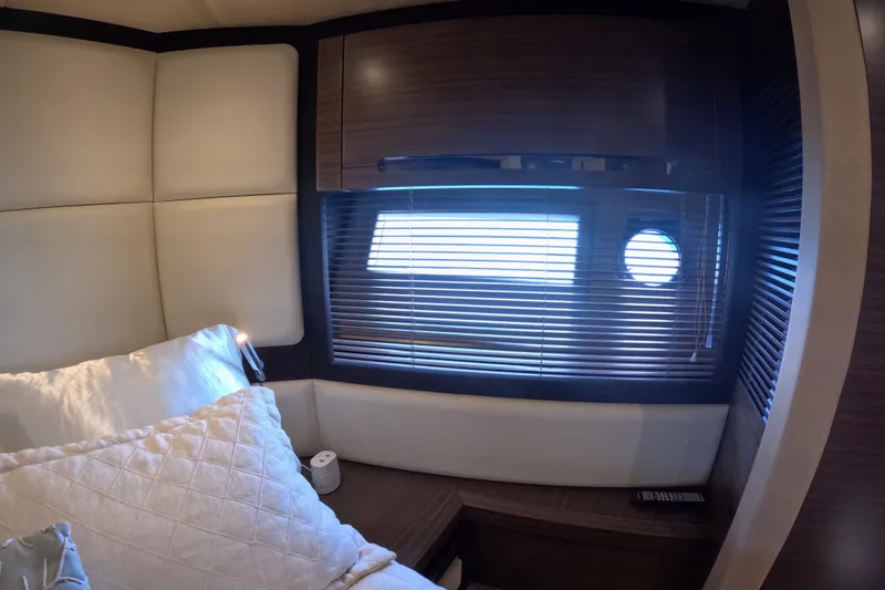 Slide: The Image of Luxurious interior cabin of 2016 Azimut 55S yacht with window blinds and plush bedding. - 125