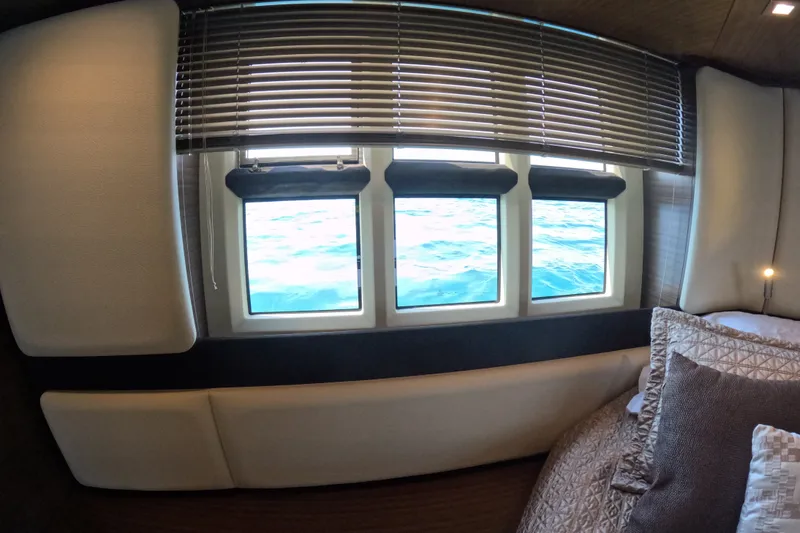 Slide: The Image of Interior view of 2016 Azimut 55S yacht cabin with ocean view through window. - 84