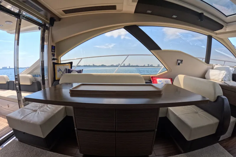 Slide: The Image of Luxurious interior of a 2016 Azimut 55S yacht with elegant seating and scenic water views. - 53