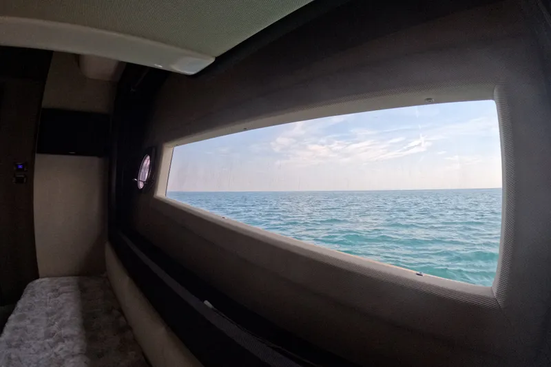 Slide: The Image of Interior view from 2016 Azimut 55S yacht, showcasing ocean through large window. - 108