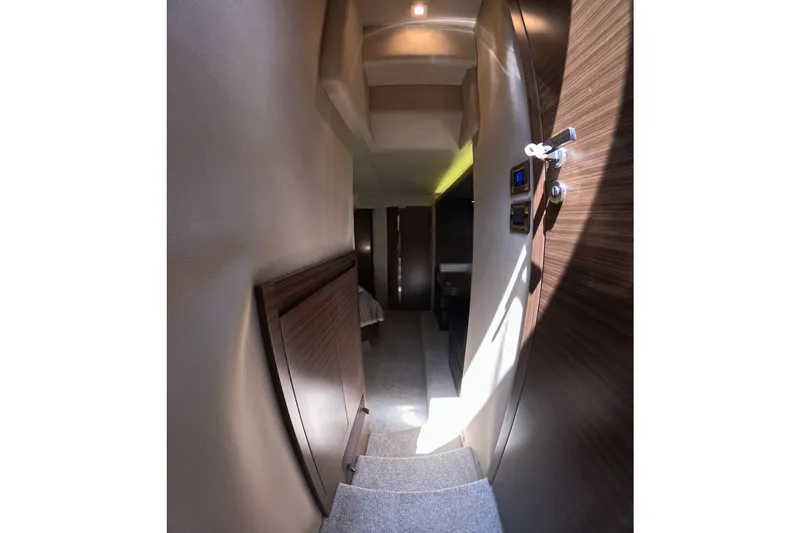 Slide: The Image of Interior hallway of 2016 Azimut 55S yacht, featuring modern design and wood accents. - 93
