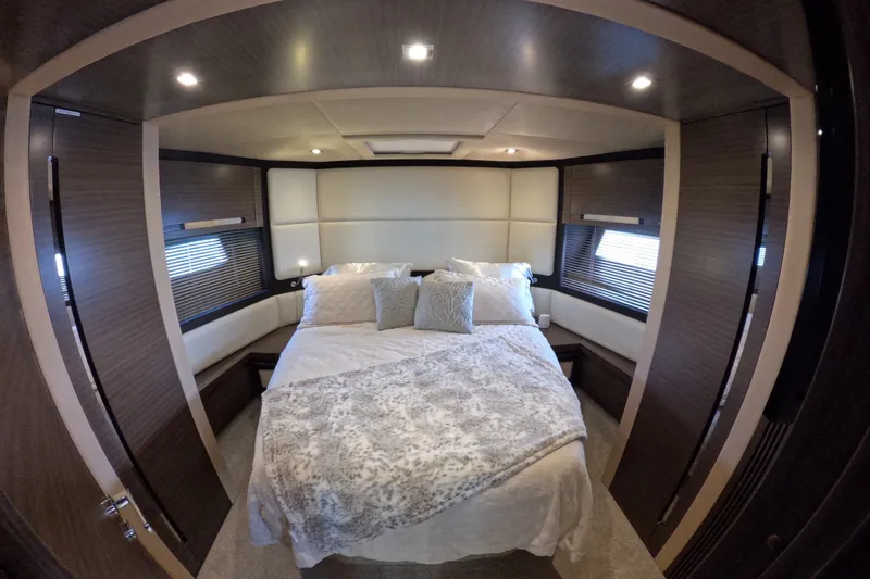 Slide: The Image of Luxurious bedroom interior of 2016 Azimut 55S yacht with elegant bedding and ambient lighting. - 118