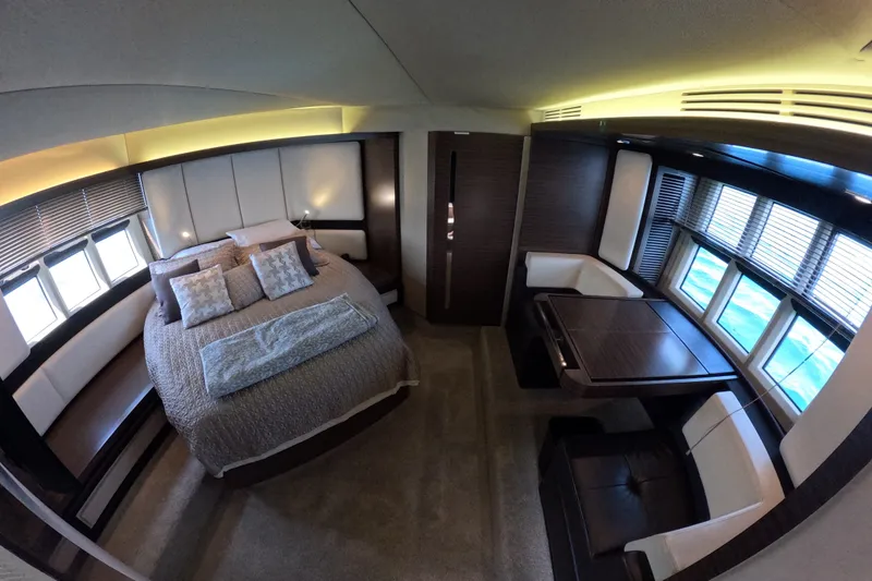 Slide: The Image of Luxurious interior of 2016 Azimut 55S yacht with elegant bedroom and seating area. - 79