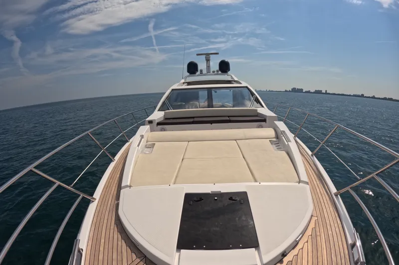 Slide: The Image of Luxury Azimut 55S yacht cruising on open sea under clear blue sky. - 24