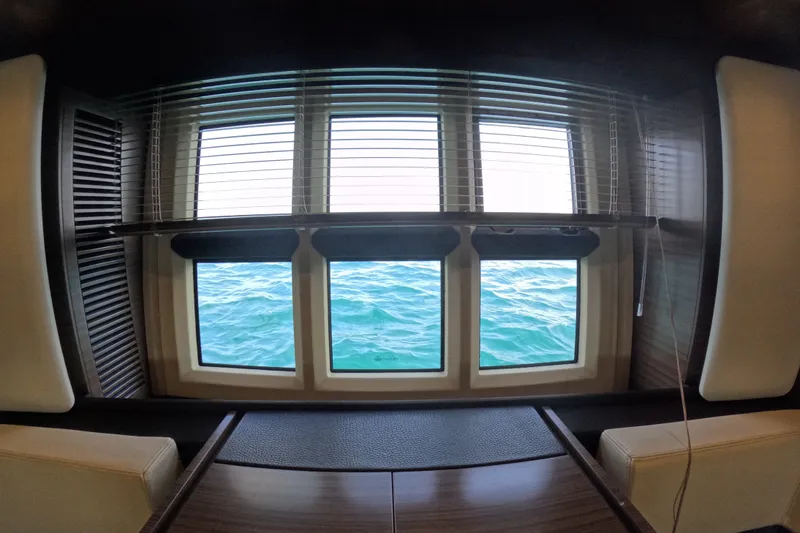 Slide: The Image of Interior view from 2016 Azimut 55S yacht, showcasing ocean through large windows. - 91