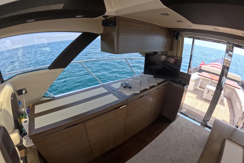 Slide: The Image of Luxurious interior of 2016 Azimut 55S yacht with ocean view and American flag. - 48
