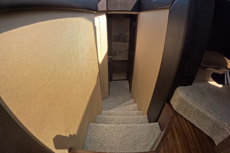 Slide: The Image of Interior staircase of 2016 Azimut 55S yacht, featuring carpeted steps and modern design. - 75