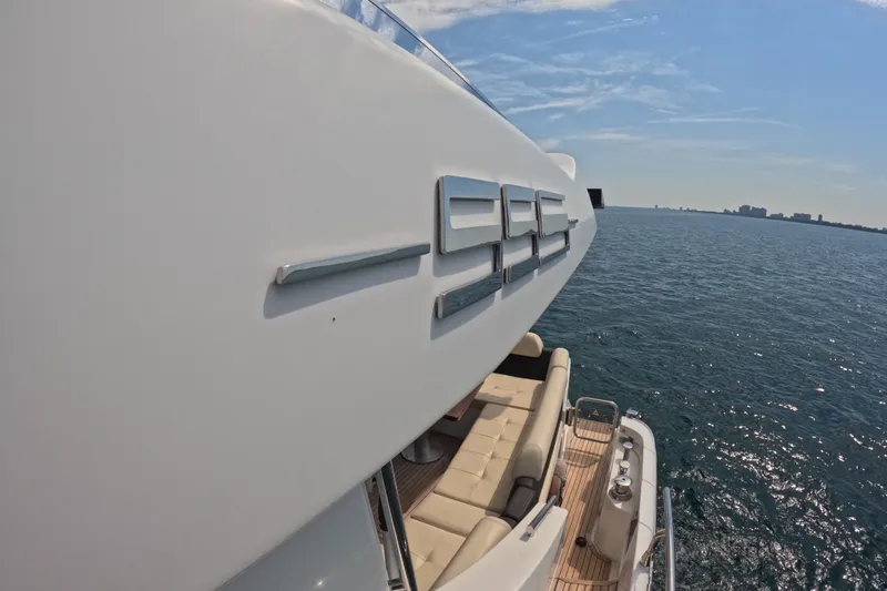 Slide: The Image of 2016 Azimut 55S yacht on open water, showcasing sleek design and luxury features. - 18