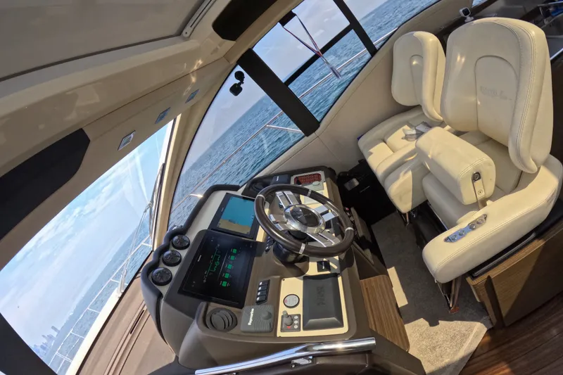 Slide: The Image of Luxurious interior of a 2016 Azimut 55S yacht with modern helm and plush seating. - 65