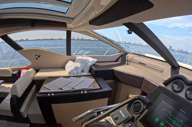 Slide: The Image of Luxurious interior of 2016 Azimut 55S yacht with panoramic windows and modern dashboard. - 66
