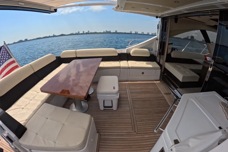 Slide: The Image of Luxury Azimut 55S yacht deck with seating, table, and ocean view, 2016 model. - 13