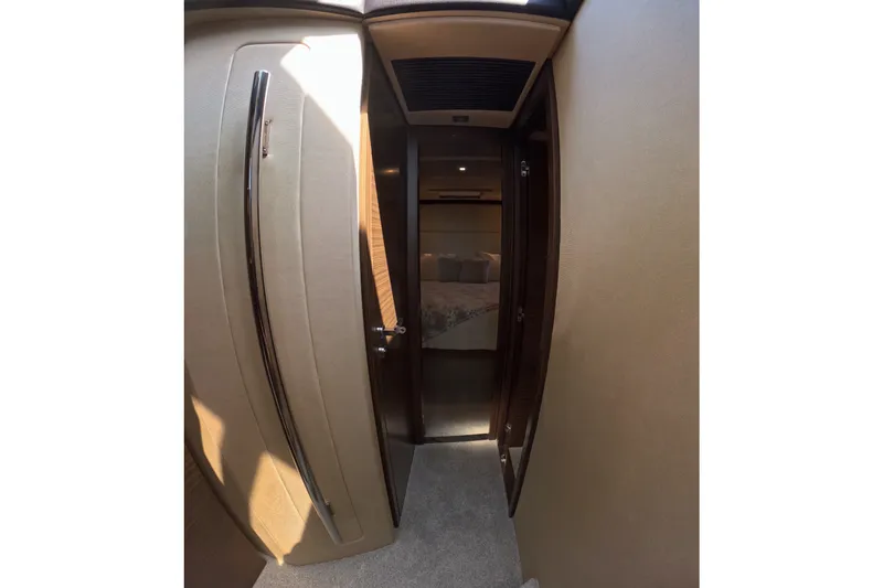 Slide: The Image of Interior hallway of 2016 Azimut 55S yacht leading to a bedroom. - 112