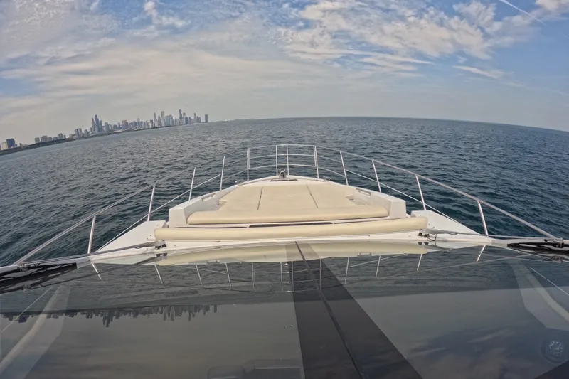 Slide: The Image of Azimut 55S yacht cruising with city skyline in the background, 2016 model. - 21